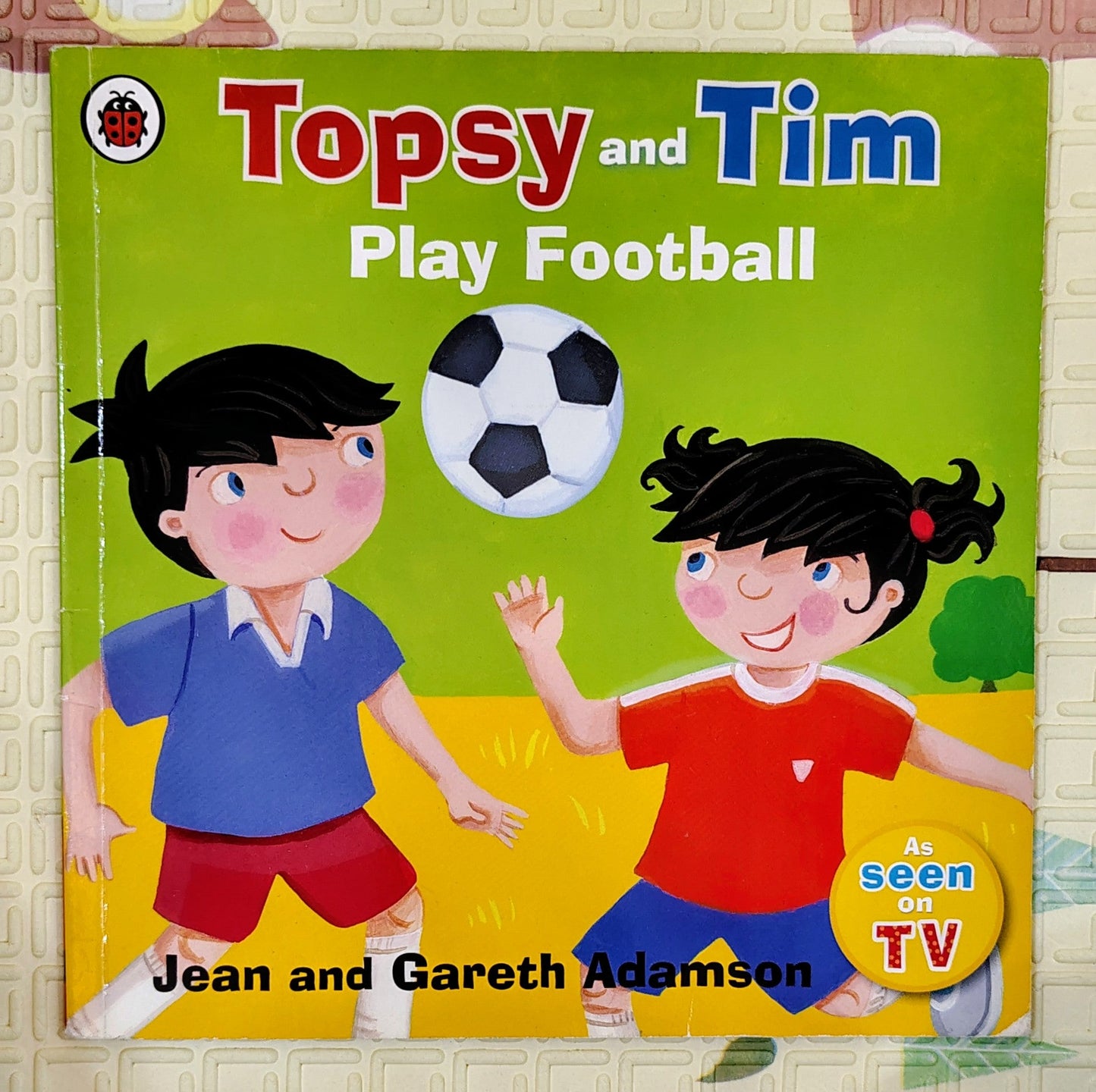 Topsy and Tim Play Football by Jean and Gareth Adamson | Ladybird