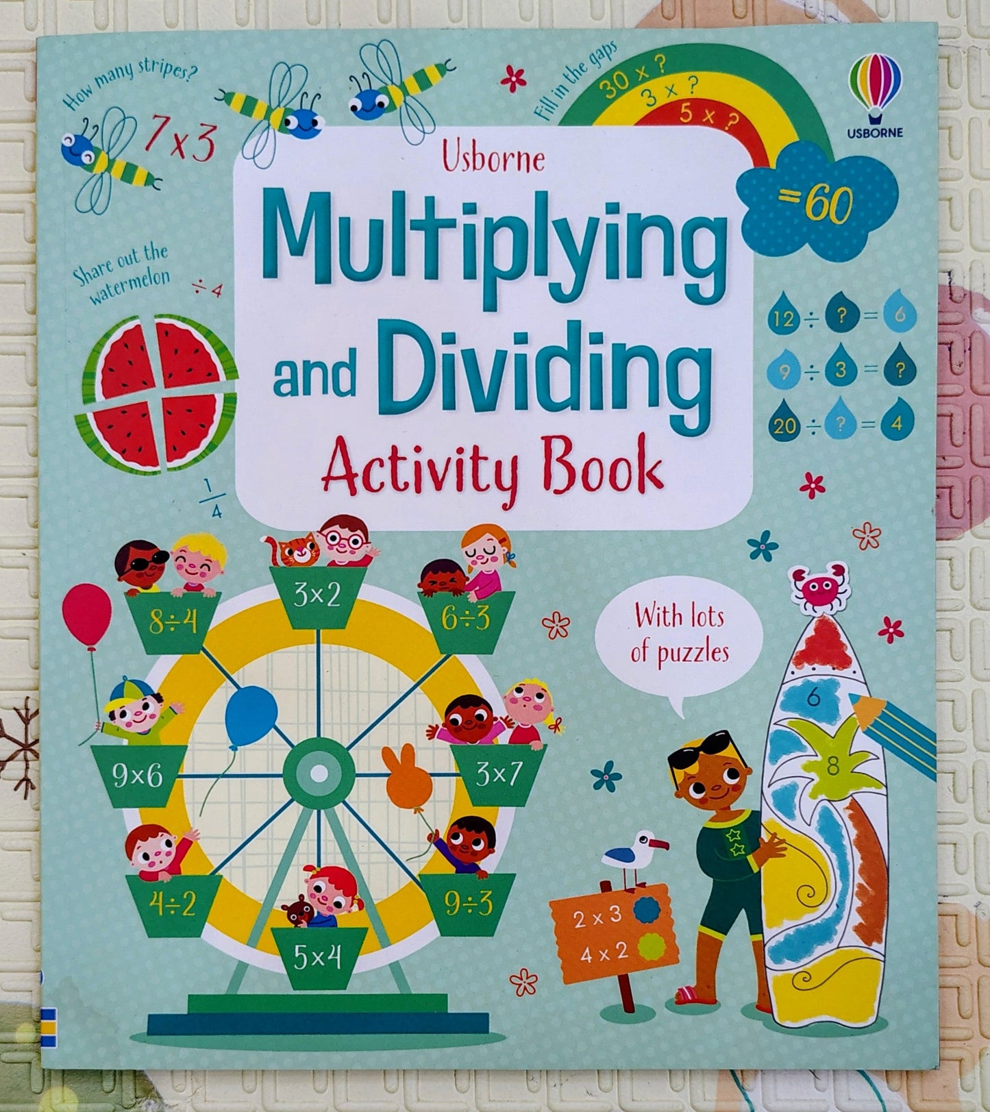 Multiplying and Dividing Activity Book by Usborne | Lots of puzzles Inside