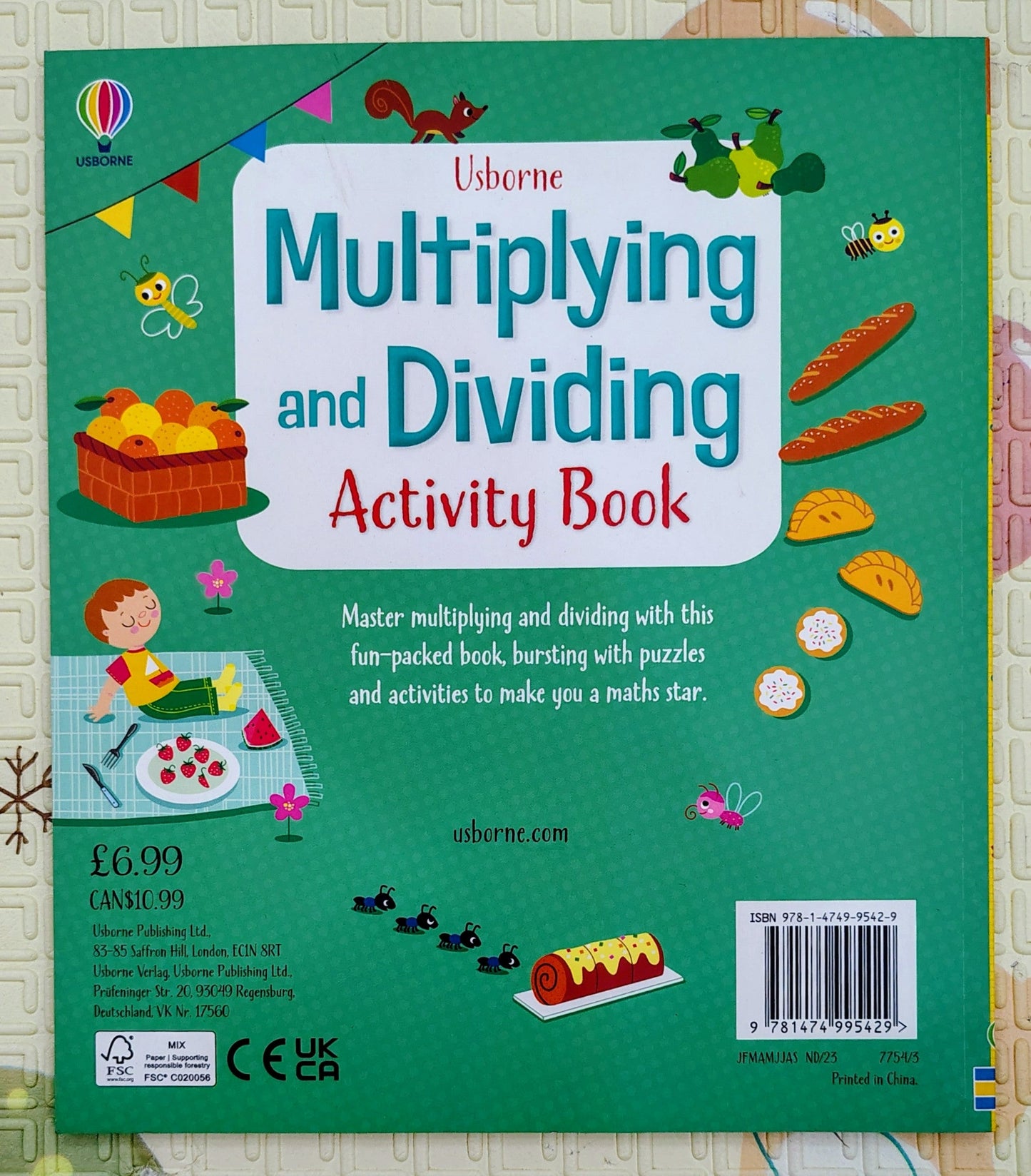 Multiplying and Dividing Activity Book by Usborne | Lots of puzzles Inside