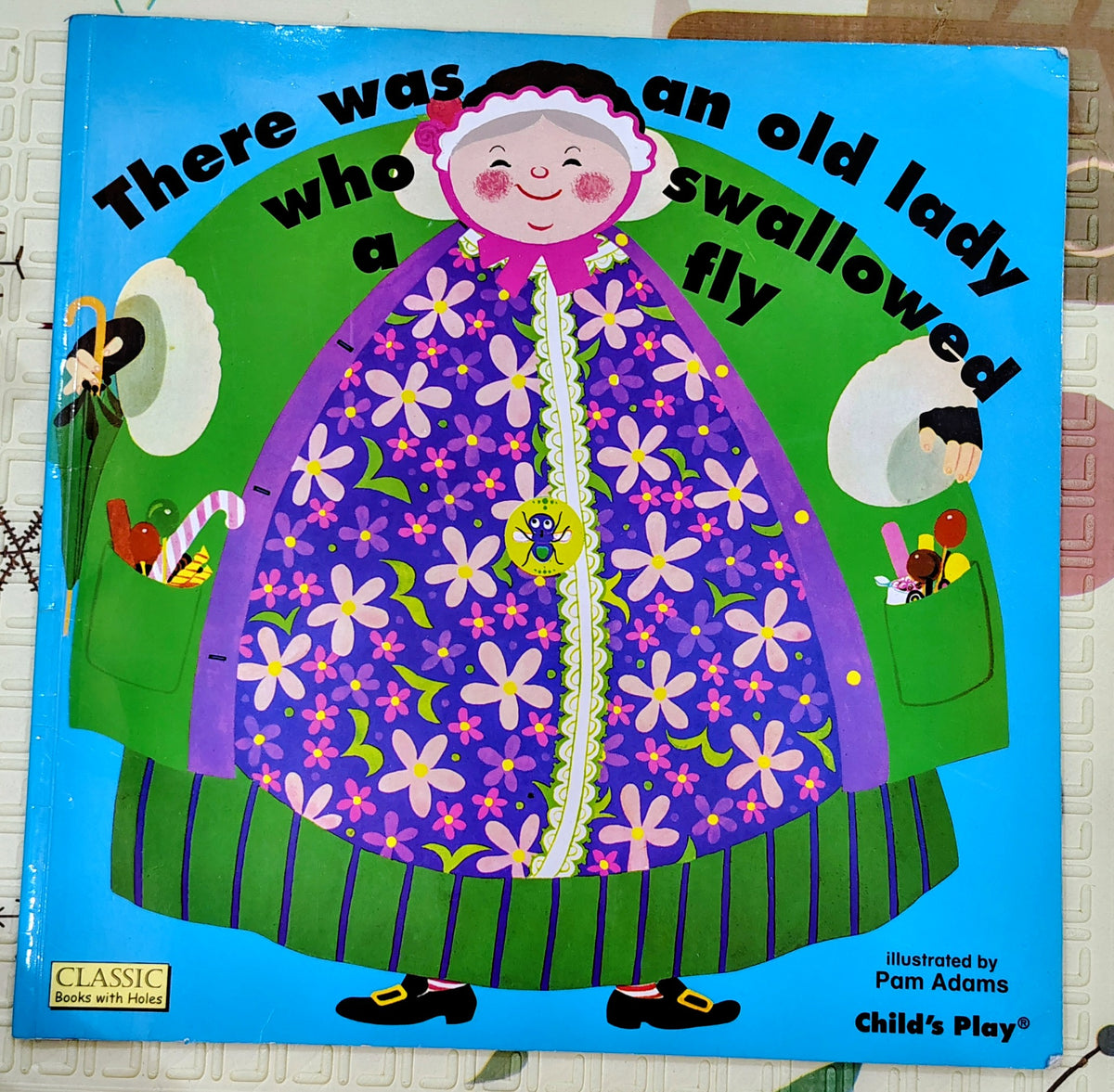 There Was an Old Lady Who Swallowed a Fly by Pam Adams | Classic story with holes
